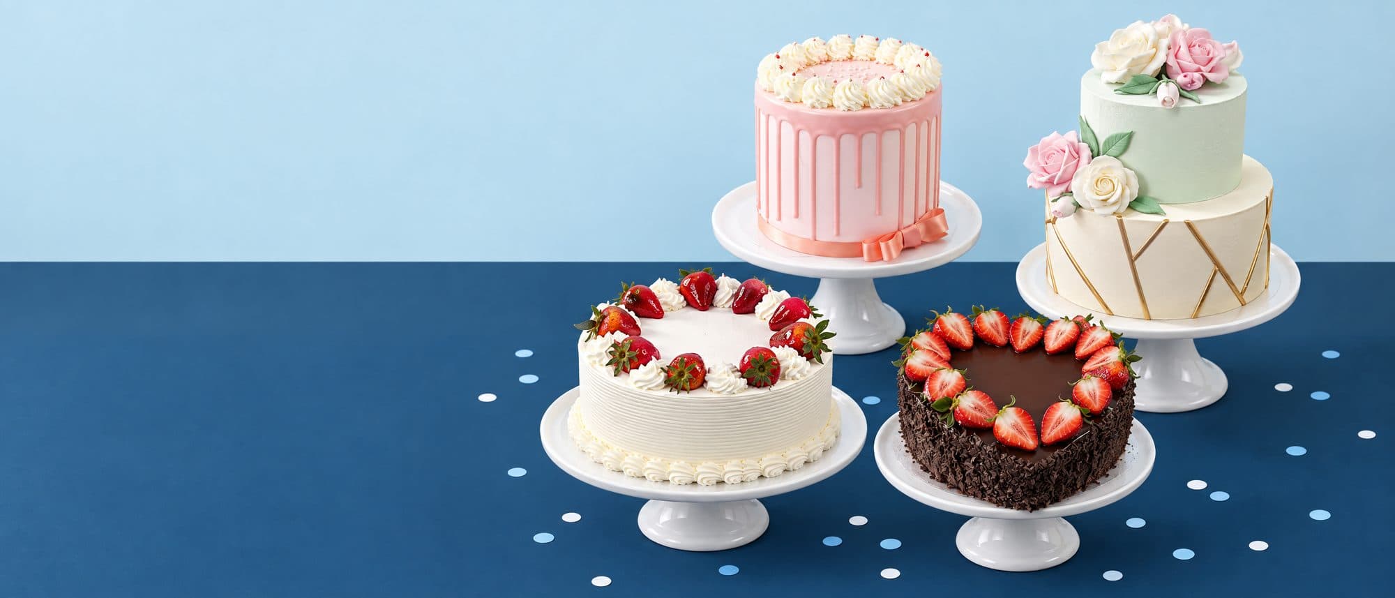 Deli Fuego celebration cakes on white stands